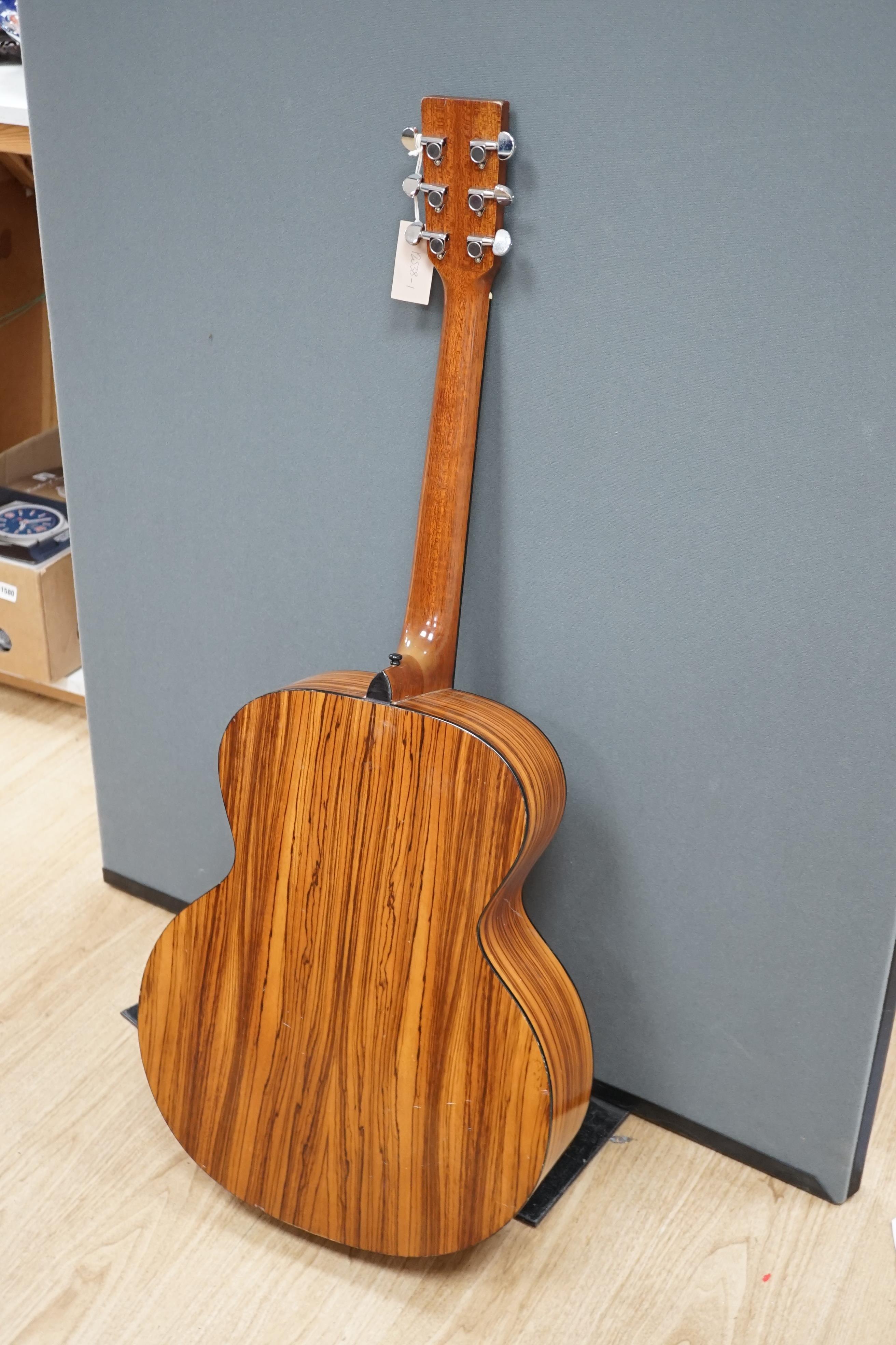 A Tanglewood acoustic guitar (left handed)